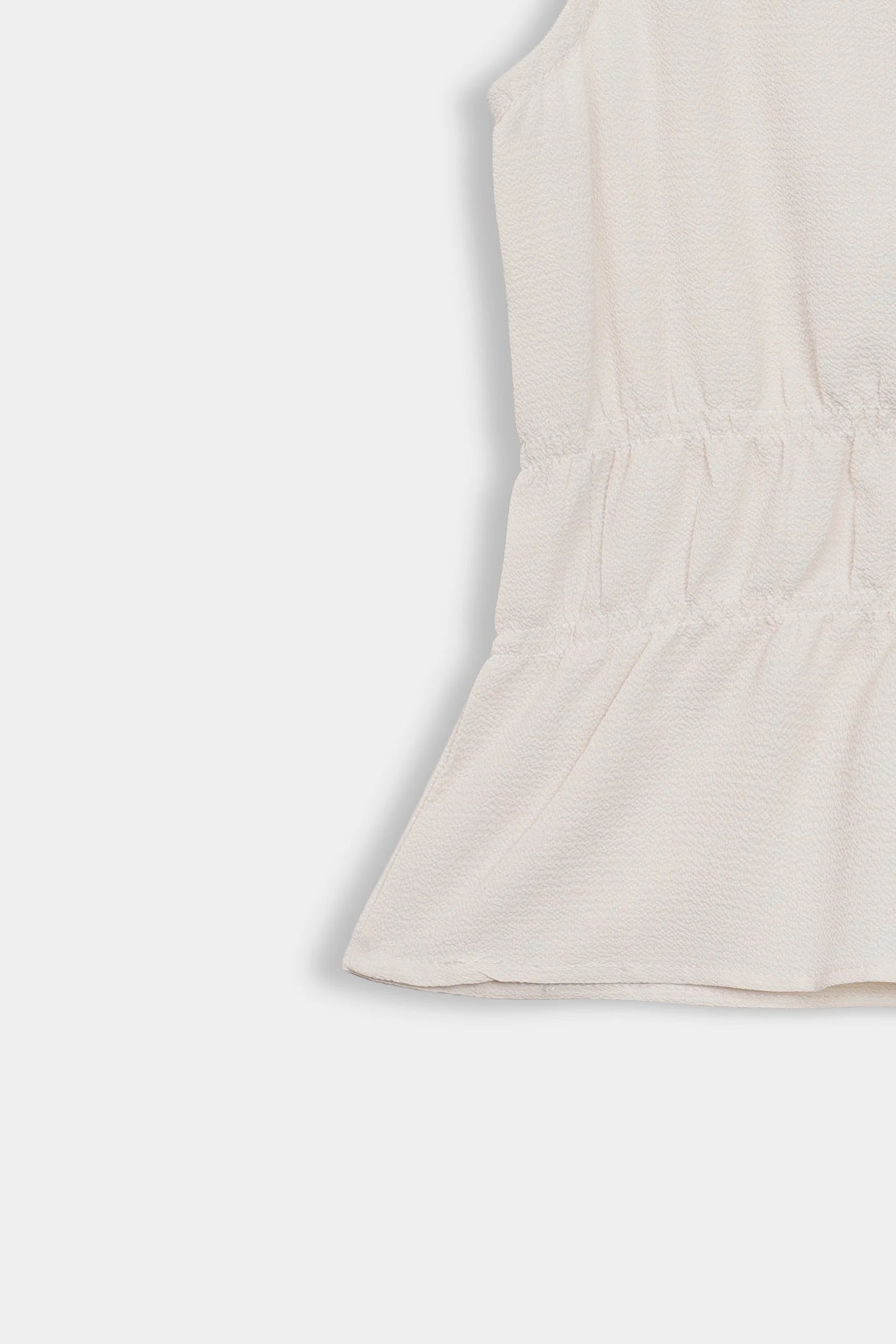 Sleeveless Peplum Top - Cougar Clothing