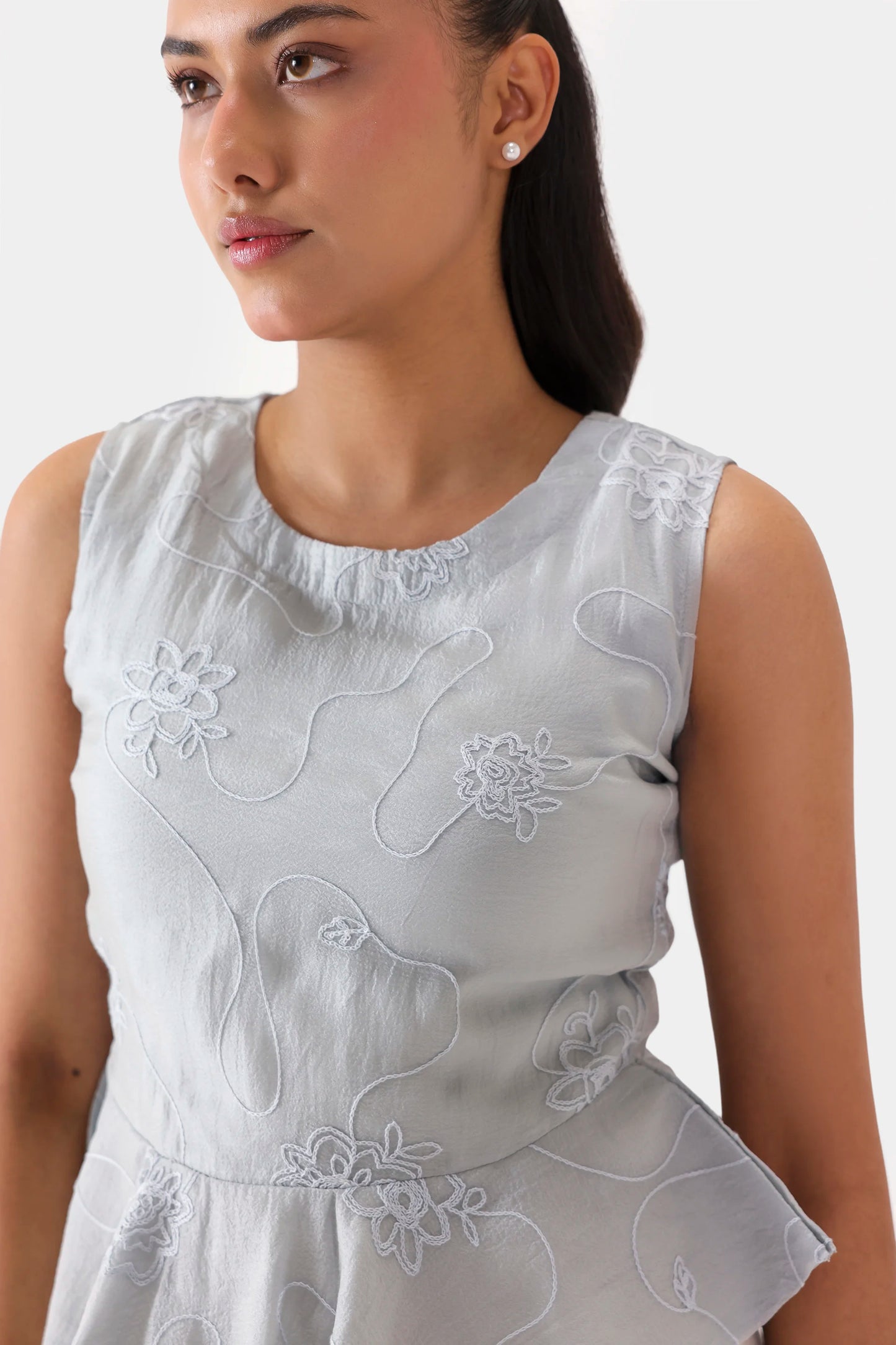 Embroidered Sleeveless Peplum - Cougar Clothing